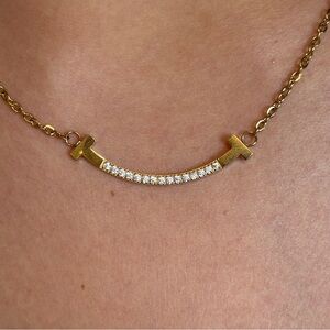 T&Co GOLD AND RHINESTONE T STYLE 'SMILE PENDANT' IN T&CO POUCH NWOT